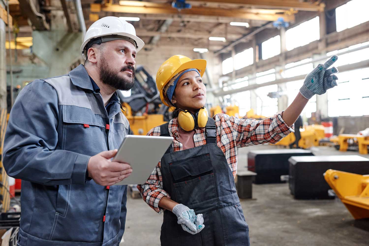 Two_Engineers_Working_In_Industrial_Plant_original_3489228